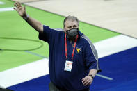 West Virginia head coach Bob Huggins waves to the crowd as he leaves the court following a win over Morehead State in a college basketball game in the first round of the NCAA tournament at Lucas Oil Stadium Saturday, March 20, 2021, in Indianapolis. (AP Photo/Mark Humphrey)