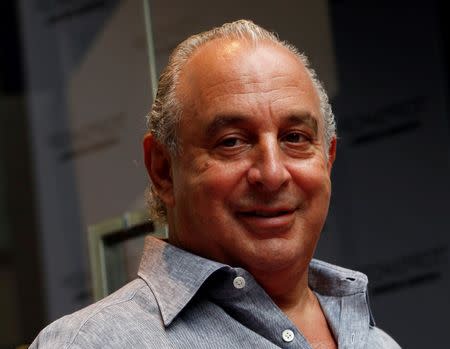 British billionaire and CEO of the Arcadia Group Philip Green smiles as he attends the opening ceremony of a Topshop flagship store in Hong Kong June 6, 2013. REUTERS/Bobby Yip/File Photo