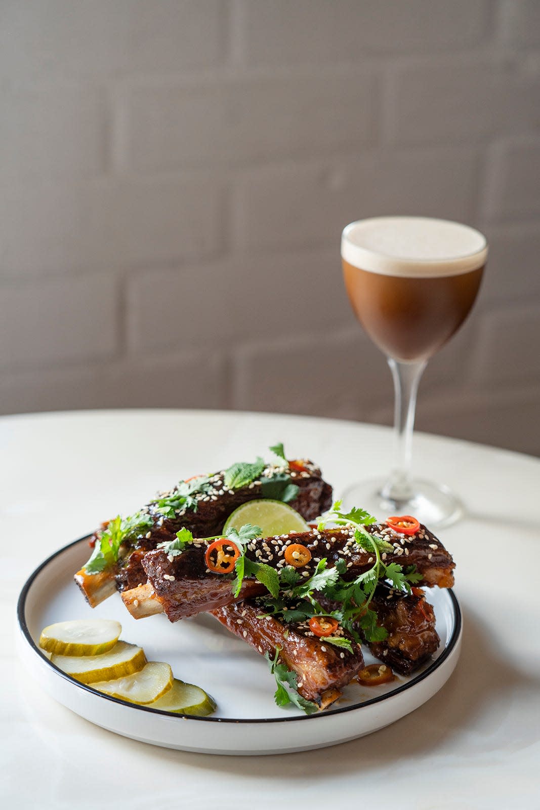 The honey-glazed ribs will make a mess out of you, and so will one too many of the espresso martinis at Holiday on 7th.