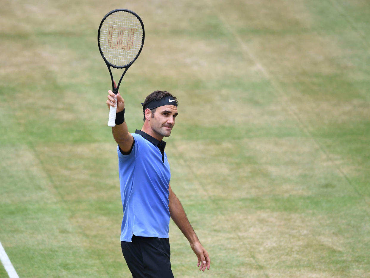 Roger Federer celebrates after seeing off his opponent: Getty