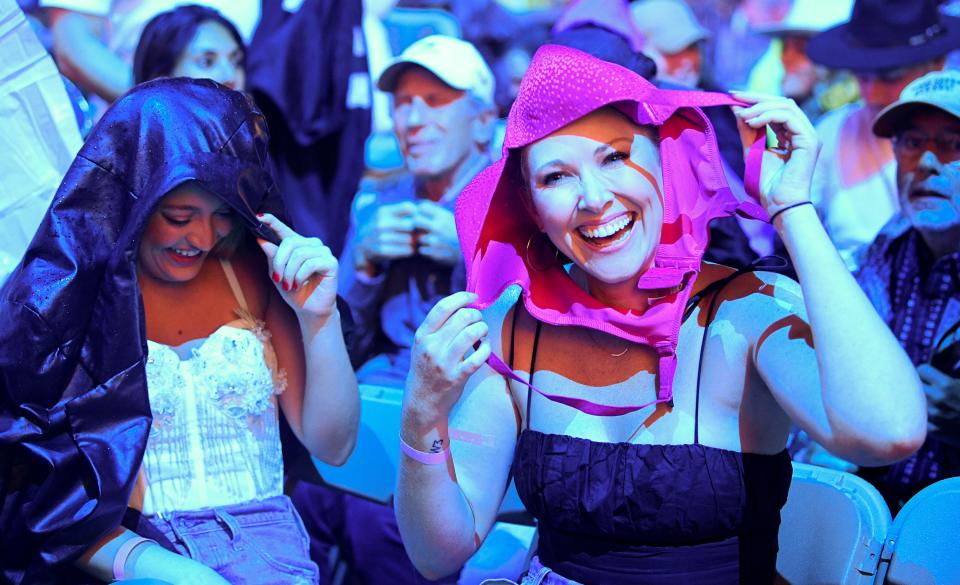 Phene Wardlaw, of Nashville, wears a bra on her head that she caught after Ashley McBryde threw it into the audience during CMA Fest at Nissan Stadium on Sunday, June 11, 2023, in Nashville, Tennessee.