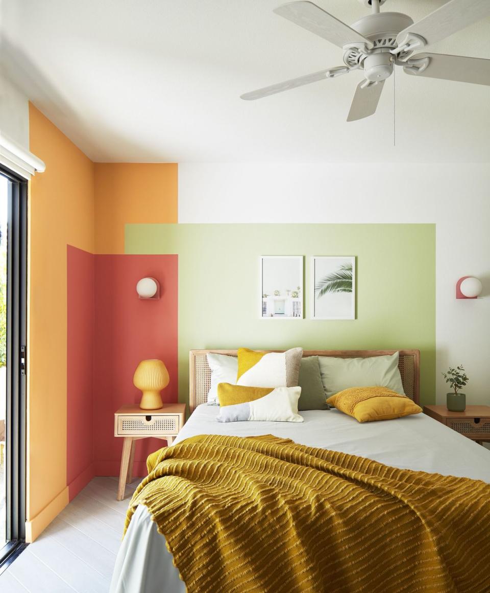 a bedroom with a fan and a bed