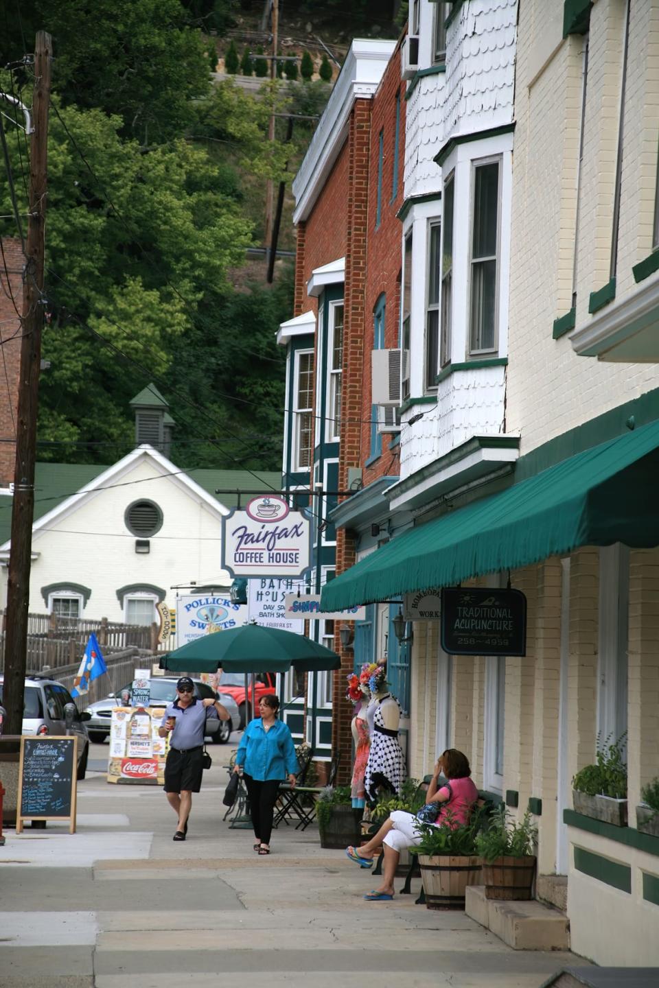 <div class="inline-image__caption"><p>People walking around the shops and restaurants on Main Street in historic Berkeley Springs, West Virginia.</p></div> <div class="inline-image__credit">Getty Images</div>