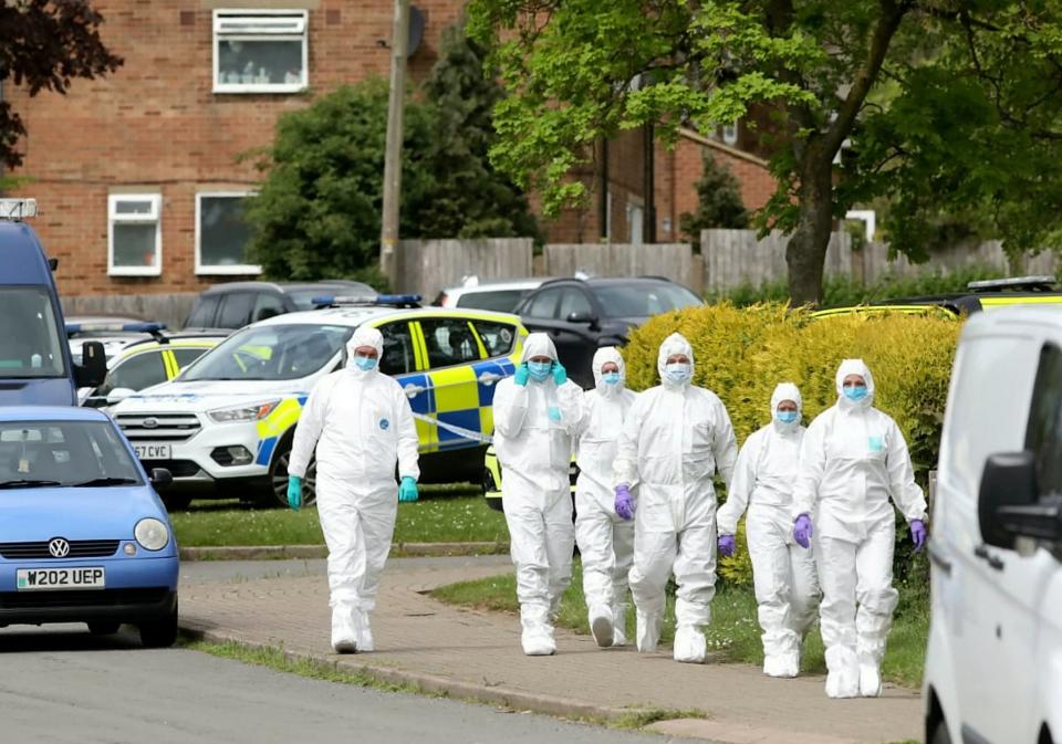 Police forensic officers at the scene of the murder of Rayon Pennycook in May last year (SWNS)