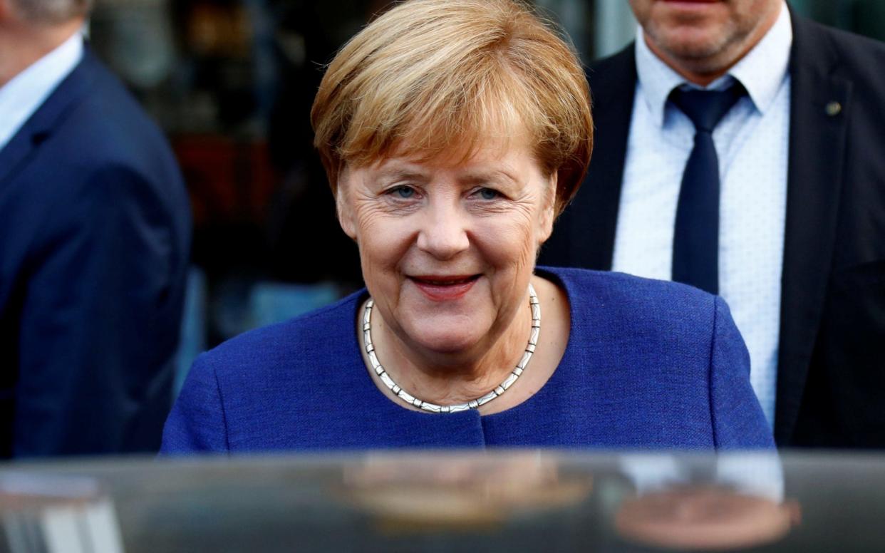 Mrs Merkel put heavy losses for her sister party in the Bavarian elections down to a 'loss of trust in politics' - REUTERS