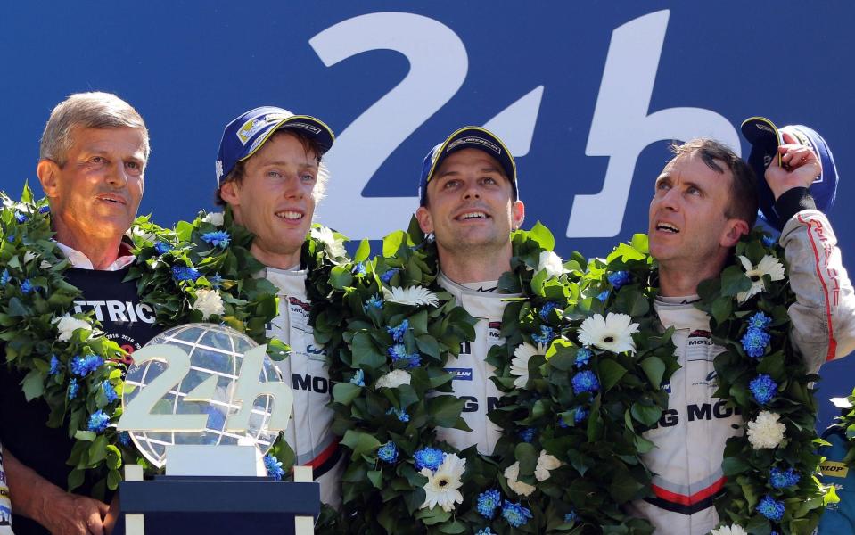 The Porsche LMP team celebrate on the podium after winning Le Mans 24 Hours - EPA