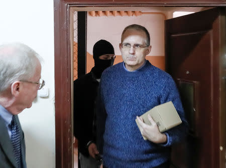 Former U.S. Marine Paul Whelan, who was detained on suspicion of spying, is escorted inside a court building before a hearing regarding the extension of his detention, in Moscow, Russia, May 24, 2019. REUTERS/Shamil Zhumatov