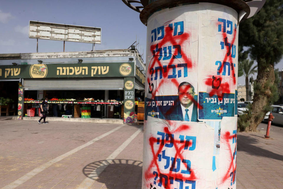 <div class="inline-image__caption"><p>Defaced electoral posters of Itamar Ben-Gvir are pasted in the southern city of Beersheva on Oct. 25, 2022.</p></div> <div class="inline-image__credit">Hazem Bader/AFP via Getty</div>