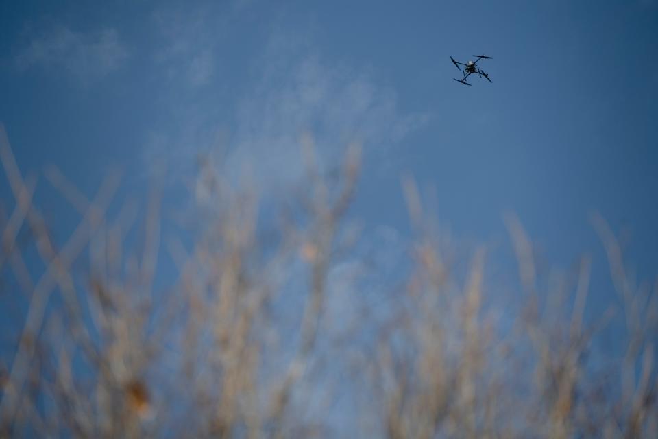 A police drone hovers near Pack Square in Asheville, November 9, 2023, before a cease-fire rally in support of Palestine.