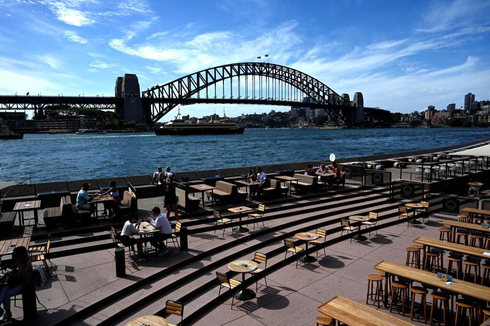 This general view shows seating for restaurants mostly empty along Sydney Harbour, usually packed with locals and tourists on Christmas Eve but now quiet due to COVID-19 coronavirus concerns, in Sydney on December 24, 2020. (Photo by Saeed KHAN / AFP) (Photo by SAEED KHAN/AFP via Getty Images)