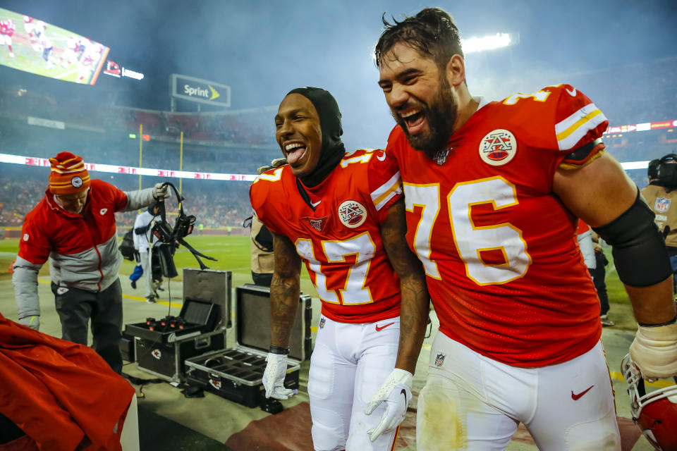 KANSAS CITY, MO - JANUARY 12: Mecole Hardman #17 of the Kansas City Chiefs and Laurent Duvernay-Tardif #76 of the Kansas City Chiefs laugh as they exit the field following the 51-31 victory over the Houston Texans in the AFC Divisional football game at Arrowhead Stadium on January 12, 2020 in Kansas City, Missouri. (Photo by David Eulitt/Getty Images)