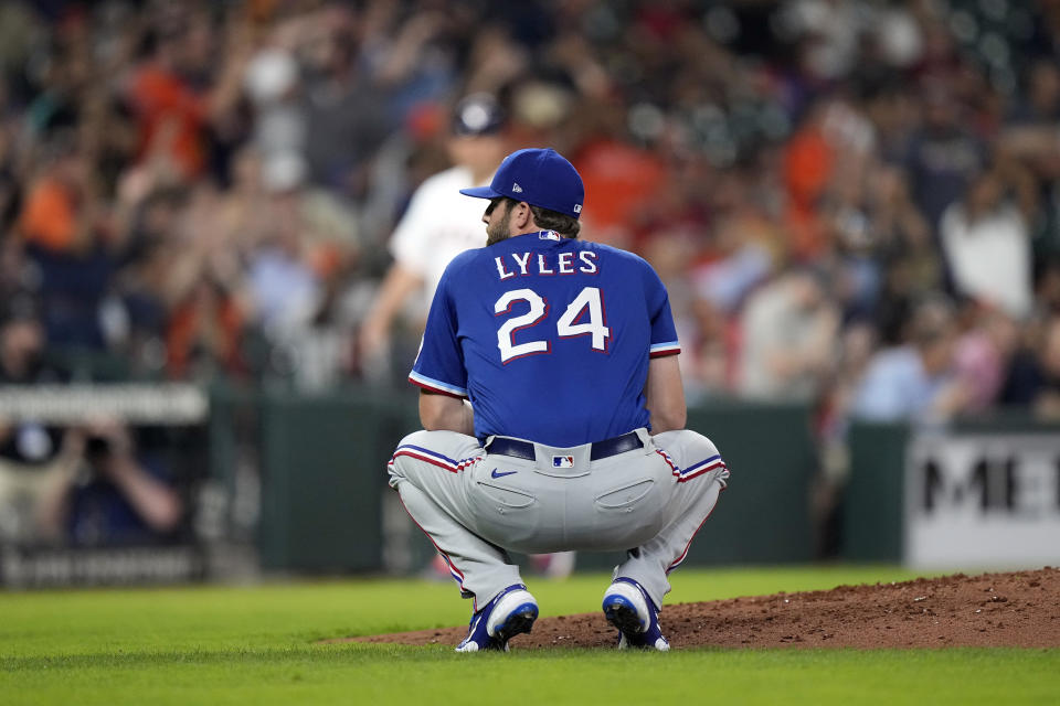 Texas Rangers starting pitcher Jordan Lyles (24) reacts after giving up a home run to Houston Astros' Myles Straw during the fourth inning of a baseball game Wednesday, June 16, 2021, in Houston. (AP Photo/David J. Phillip)