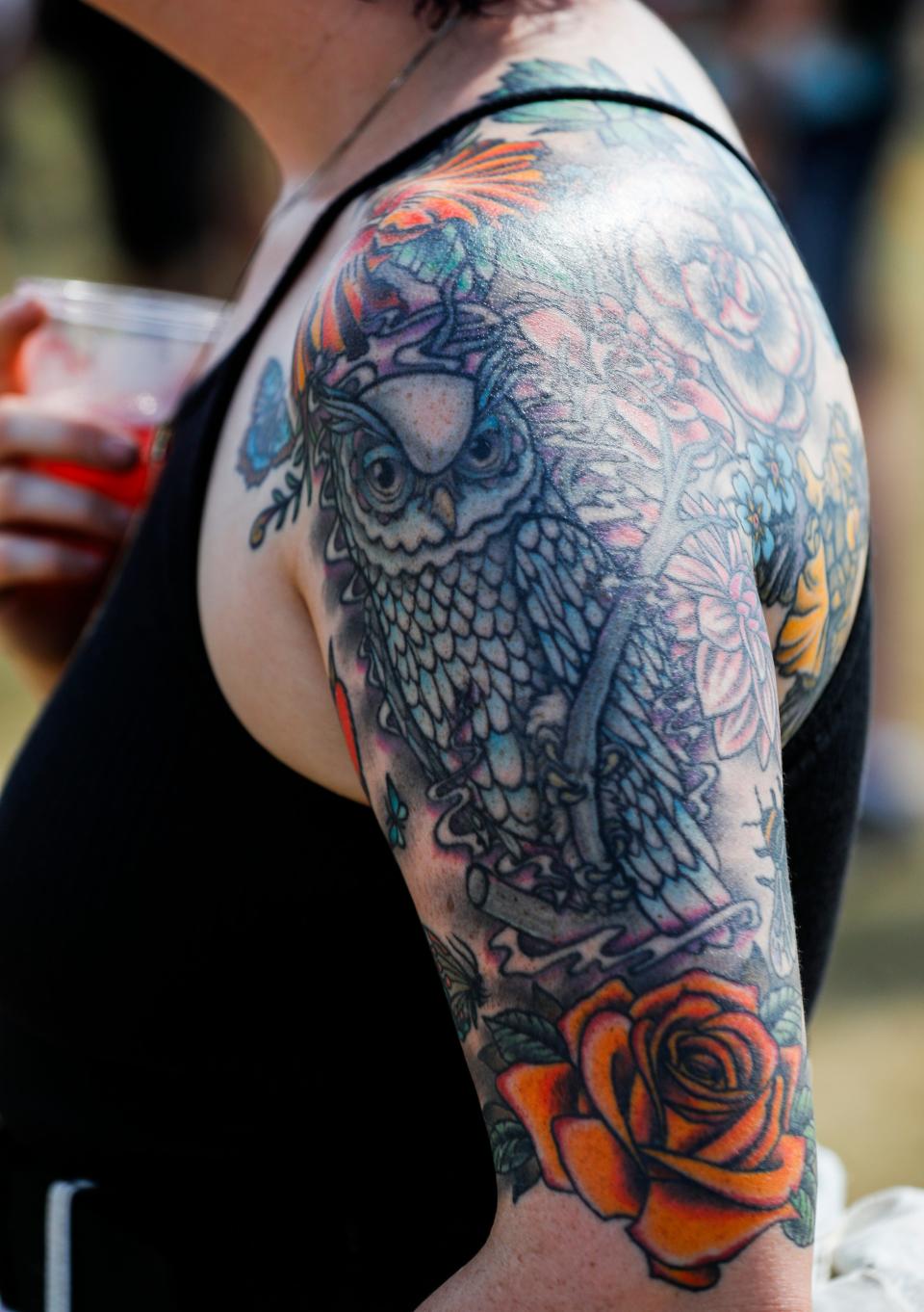 Rock fan's tattoos were on display at Friday's Louder Than Life music festival. Sept. 22, 2023
