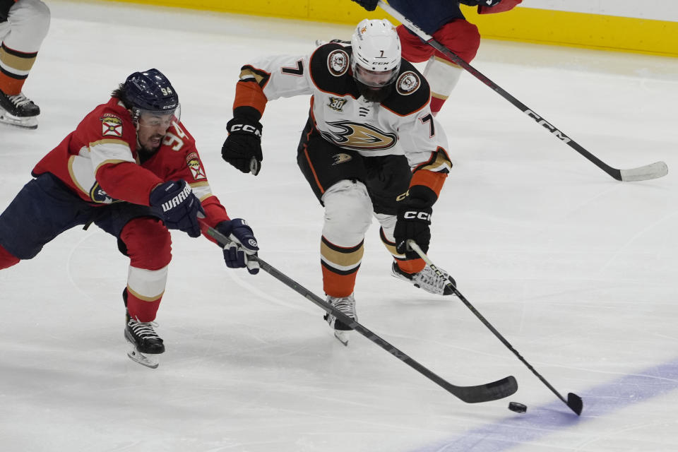 Florida Panthers left wing Ryan Lomberg (94) andAnaheim Ducks defenseman Radko Gudas (7) go after the puck during the second period of an NHL hockey game, Monday, Jan. 15, 2024, in Sunrise, Fla. (AP Photo/Marta Lavandier)