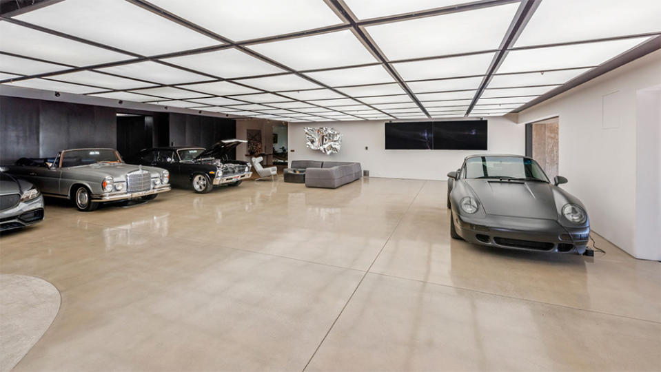 The home includes an eye-popping garage inspired by “2001: A Space Odyssey” with room for more than a dozen automobiles.