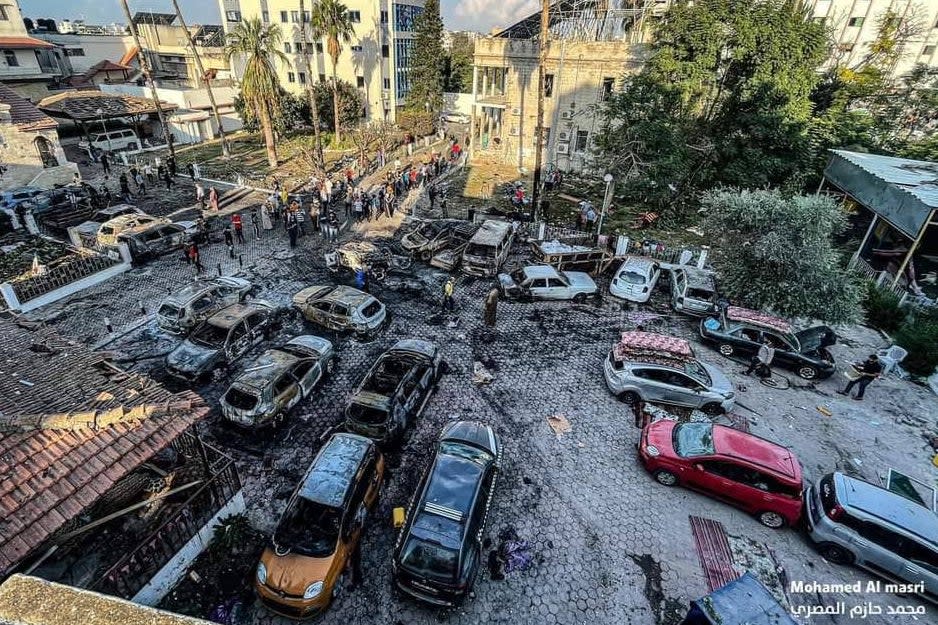 The aftermath of an explosion that allegedly took place in the car park of Al Ahli Arabi Hospital (Mohammed al Masri/Reuters)