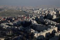 A general view picture shows Pisgat Zeev in the foreground and the Shuafat refugee camp behind the Israeli barrier in East Jerusalem, in an area Israel annexed to Jerusalem after capturing it in the 1967 Middle East war