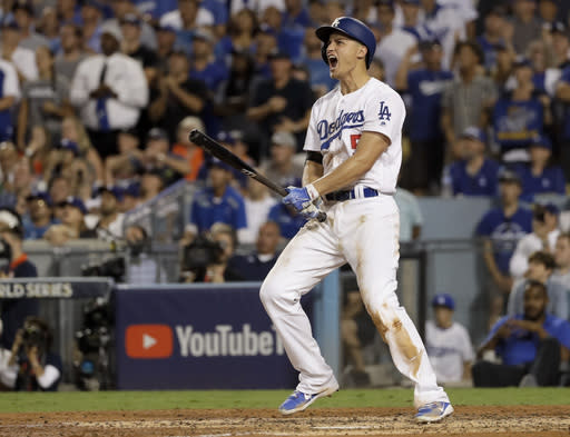 Los Angeles Dodgers’ Corey Seager celebrates after a two-run home run against the Houston Astros during the sixth inning of Game 2 of baseball’s World Series Wednesday, Oct. 25, 2017, in Los Angeles. (AP Photo/Matt Slocum)