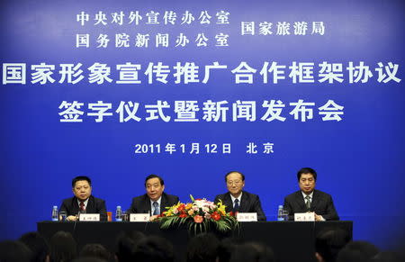 Chinese officials seen at a news conference on promoting the Image of China in Beijing, China, January 12, 2011. REUTERS/Stringer/File Photo