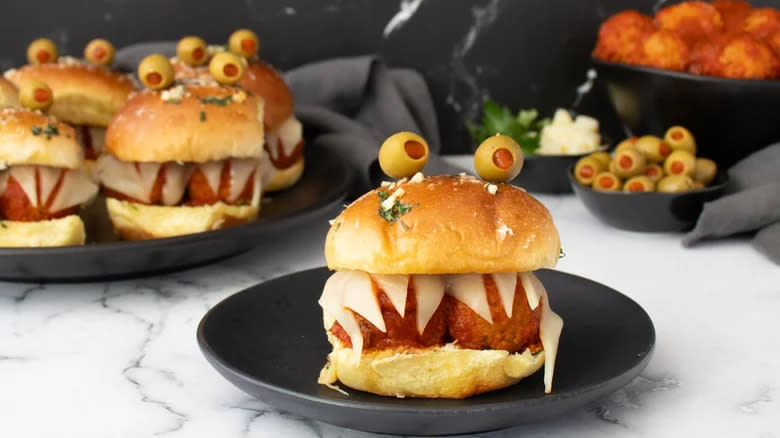 Creative meatball sliders with olives and cheese 