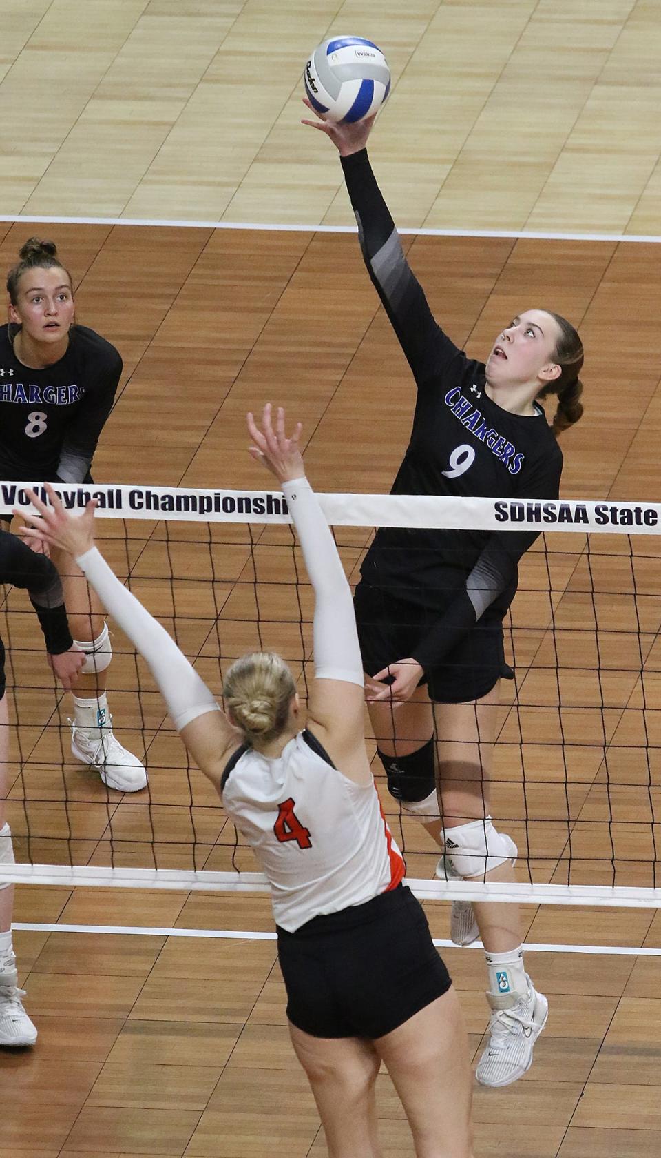 Sioux Falls Christian's Taylor Byl hits over Dell Rapids' Lauryn Kloth during their semifinal match in the state Class A volleyball tournament on Friday, Nov. 17, 2023 in the Summit Arena at The Monument in Rapid City.