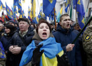 <p>Members of nationalist groups shout slogans during a rally to mark the third anniversary of the Maidan protests outside the Ukrainian Parliament in Kiev, Ukraine, Feb. 22, 2017. (AP Photo/Sergei Chuzavkov) </p>