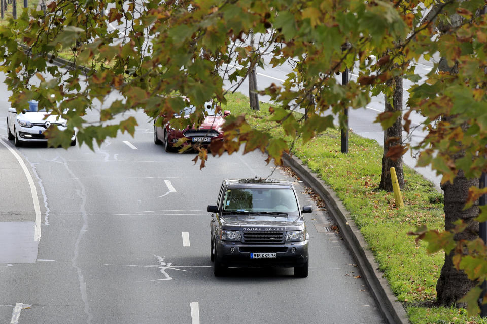 A SUV drives Wednesday, Nov. 13, 2019 in Paris. The world's thirst for oil will continue to grow until the 2030s, with climate-damaging emissions climbing until at least 2040 — and consumers' insatiable appetite for SUVs is a big reason why. (AP Photo/Michel Euler)