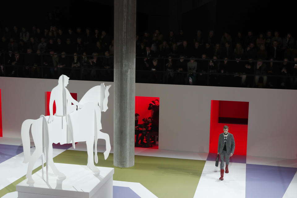 A model wears a creation as part of the Prada men's Fall-Winter 2020/21 collection, that was presented in Milan, Italy, Sunday, Jan. 12, 2020. (AP Photo/Antonio Calanni)