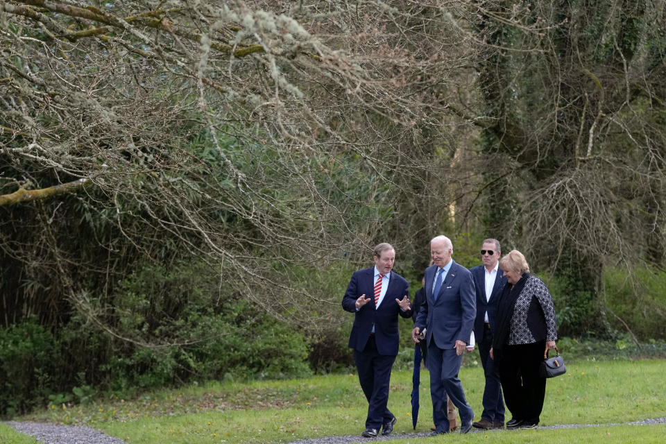 Former Taoiseach Enda Kenny, left, and his wife Fionnuala Kenny, right, talk with President Joe Biden and his son Hunter Biden, second from right, during a tour at the North Mayo Heritage Center in County Mayo, Ireland, Friday, April 14, 2023. (AP Photo/Patrick Semansky)