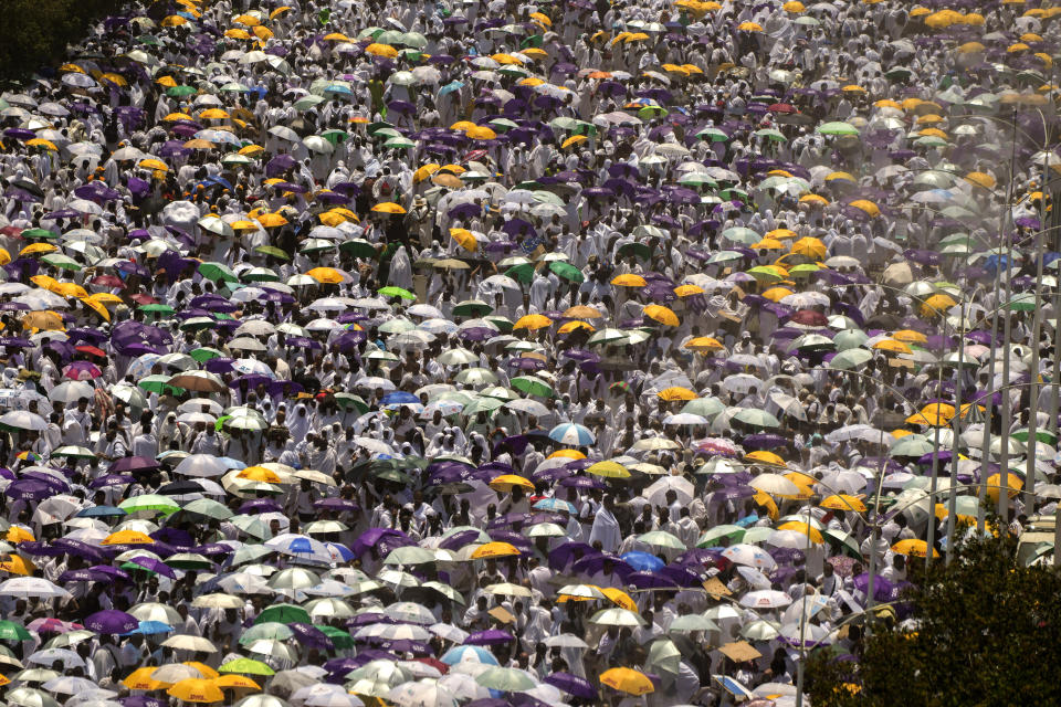 Muslim pilgrims leave prayers outside Namira Mosque in Arafat on the second day of the annual Hajj pilgrimage near the holy city of Mecca, Saudi Arabia, Tuesday, June 27, 2023. Around two million pilgrims are converging on Saudi Arabia's holy city of Mecca for the largest Hajj since the coronavirus pandemic severely curtailed access to one of Islam's five pillars. (AP Photo/Amr Nabil)