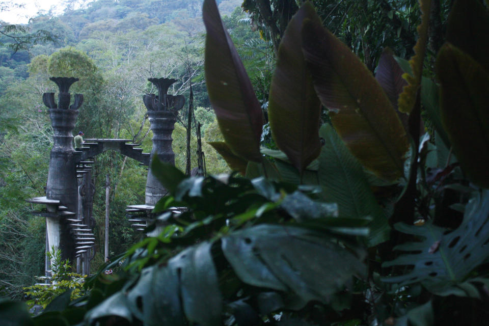 This Jan. 31, 2014 photo, shows two spiral staircases leading nowhere amid an ornate concrete structure in Las Pozas, a dreamy, little-known garden of surreal art, where sculptures evoke the ruins of ancient Greece but are overrun by exotic plants in Mexico’s northeast jungle. The garden was created by the late Edward James, a British multimillionaire and arts patron who favored surrealists like Rene Magritte and Salvador Dali. (AP Photo/Teresa de Miguel Escribano)