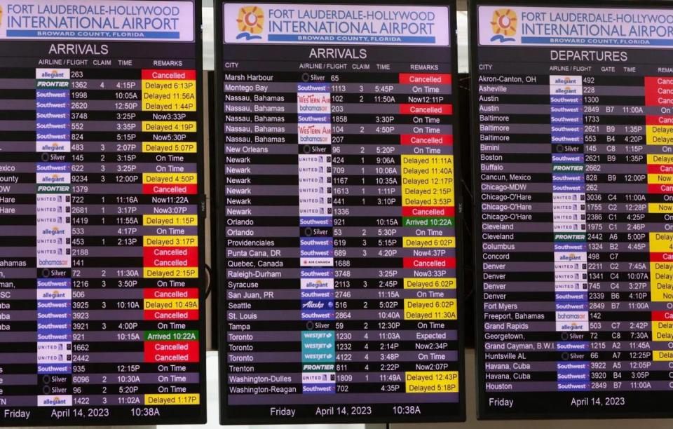 An information board shows delayed and cancelled flights at Fort Lauderdale-Hollywood International Airport on Friday, April 14, 2023.