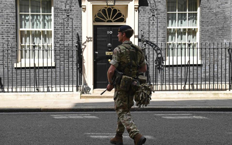 An armed soldier in Downing Street - Credit: JUSTIN TALLIS/AFP