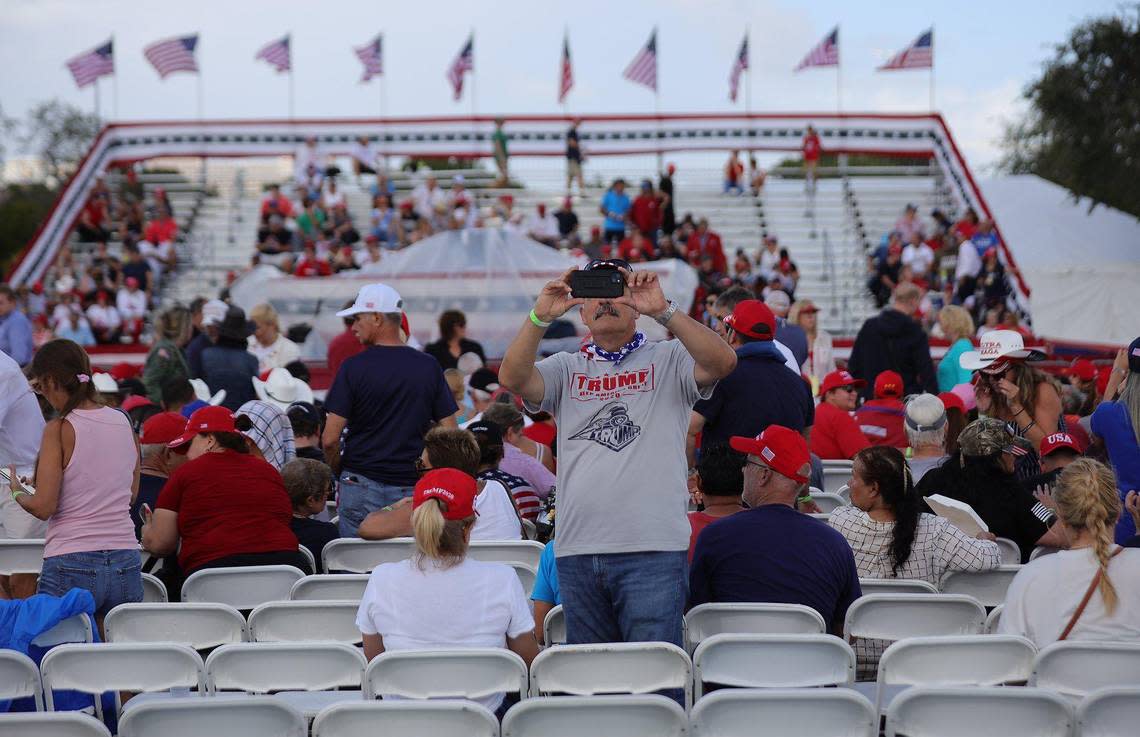 A Trump supporter takes pictures of the media as they prepare for a rally at the Youth Fairgrounds in Miami. On Sunday, November 6, 2022 former President Donald Trump and a collection of other national and local Republicans campaigned with U.S. Sen. Marco Rubio on the eve of the Nov. 8 election.