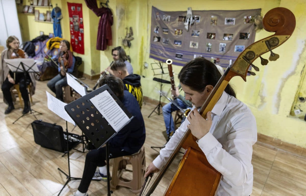 Musicians play during the first rehearsal with the small symphonic orchestra of fellow Russian musicians (Reuters)