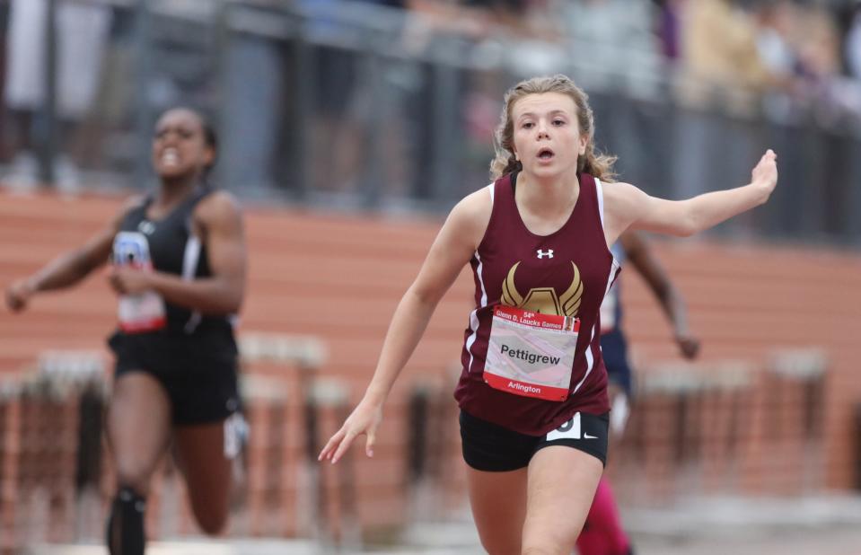 Arlington's Riley Pettigrew crosses the finishline in the 200-meter dash during  Day 2 of the Loucks Games track and field meet at White Plains High School on Friday, May 13, 2022.