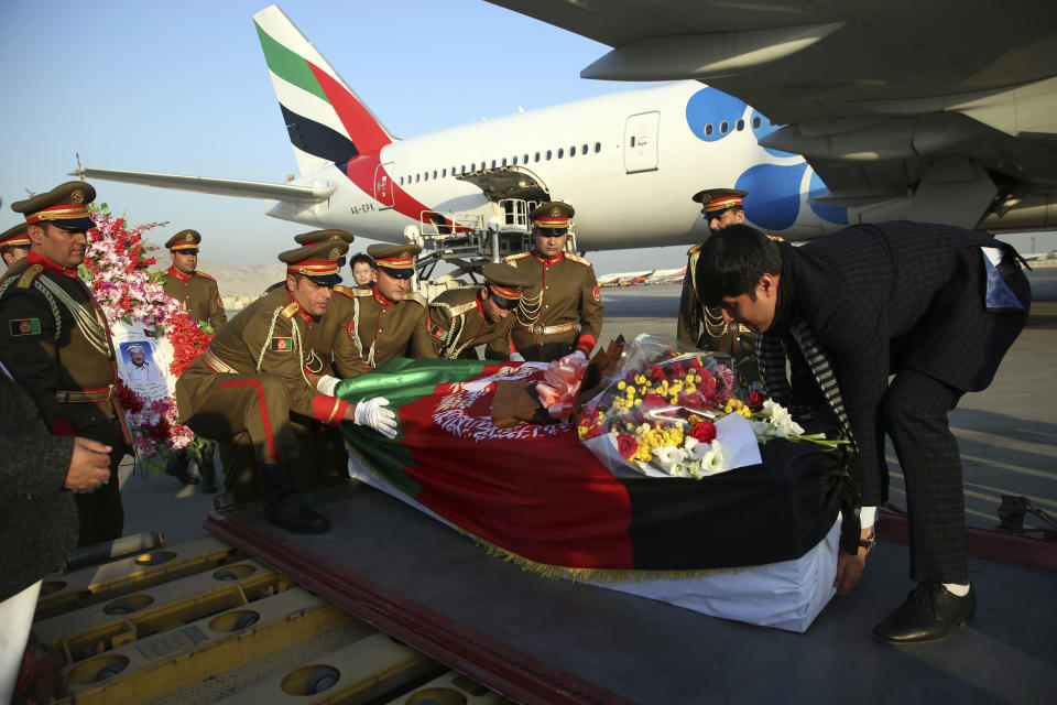 The coffin of Japanese physician Tetsu Nakamura is loaded into a plane after a ceremony at the Hamid Karzai International Airport in Kabul, Afghanistan, Saturday, Dec. 7, 2019. Nakamura was killed earlier this week in a roadside shooting in eastern Afghanistan. (AP Photo/Rahmat Gul)
