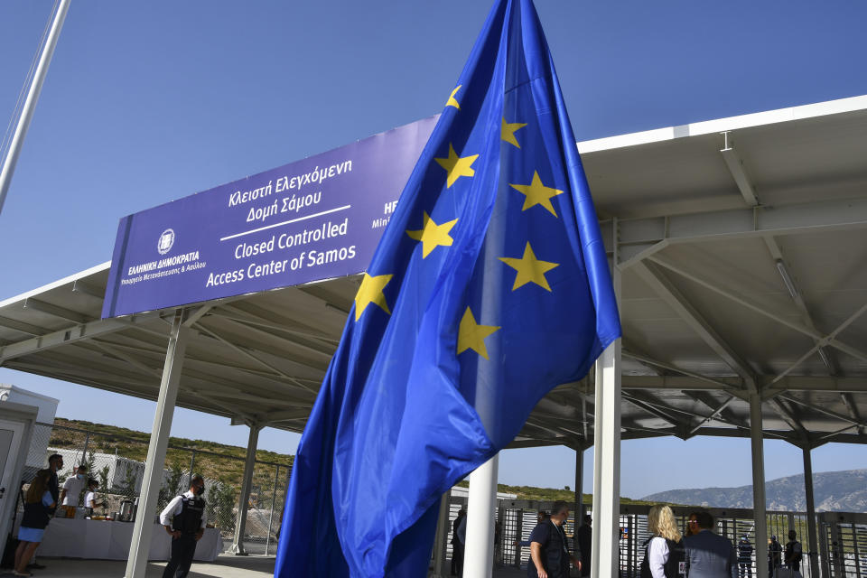 A view of the entrance of the new multi-purpose reception and identification migrant centre which was constructed near Vathy town, on the eastern Aegean island of Samos, Greece, Saturday, Sept. 18, 2021. The centre constructed following a 121 million euros agreement between the European Commission and the Greek Ministry of Migration and Asylum, an amount granted to Greece for the construction of 3 reception centres on the islands of Samos, Kos, and Leros. (AP Photo/Michael Svarnias)