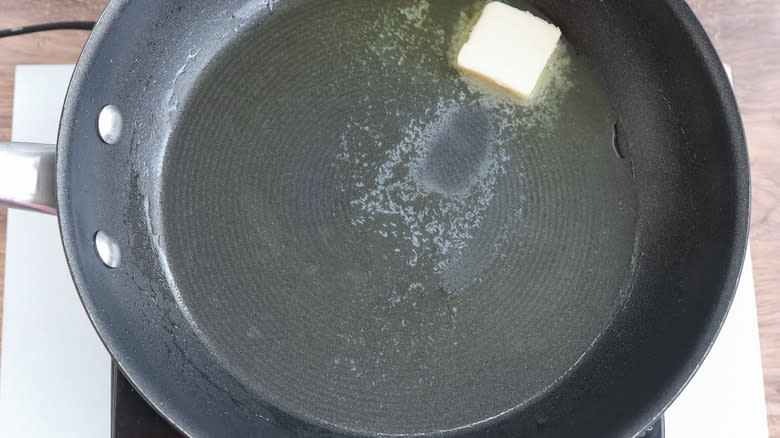 butter melting in skillet