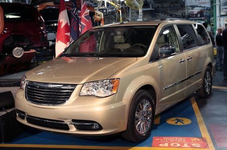 A new 2011 Chrysler Town & Country minivan is displayed during a celebration ceremony for the production launch of the new 2011 Dodge Grand Caravan and Chrysler Town & Country mnivans at the Windsor Assembly Plant in Windsor, Ontario January 18, 2011. REUTERS/Rebecca Cook