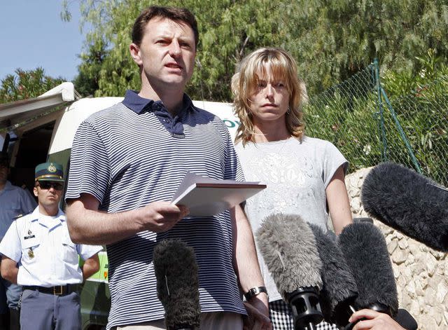 <p>MELANIE MAPS/AFP/Getty</p> Gerry and Kate McCann read a statement to the press outside on May 11, 2007.