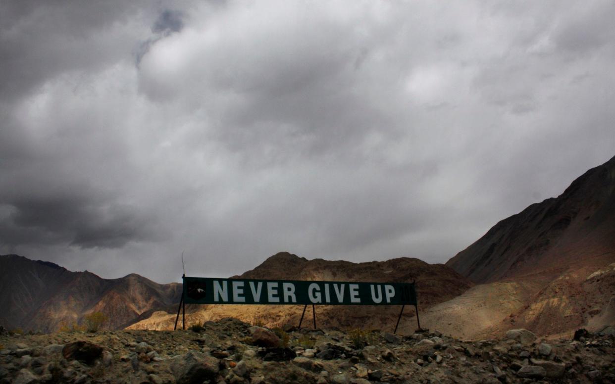 A banner erected by the Indian army stands near Pangong Tso lake near the India-China border  - AP