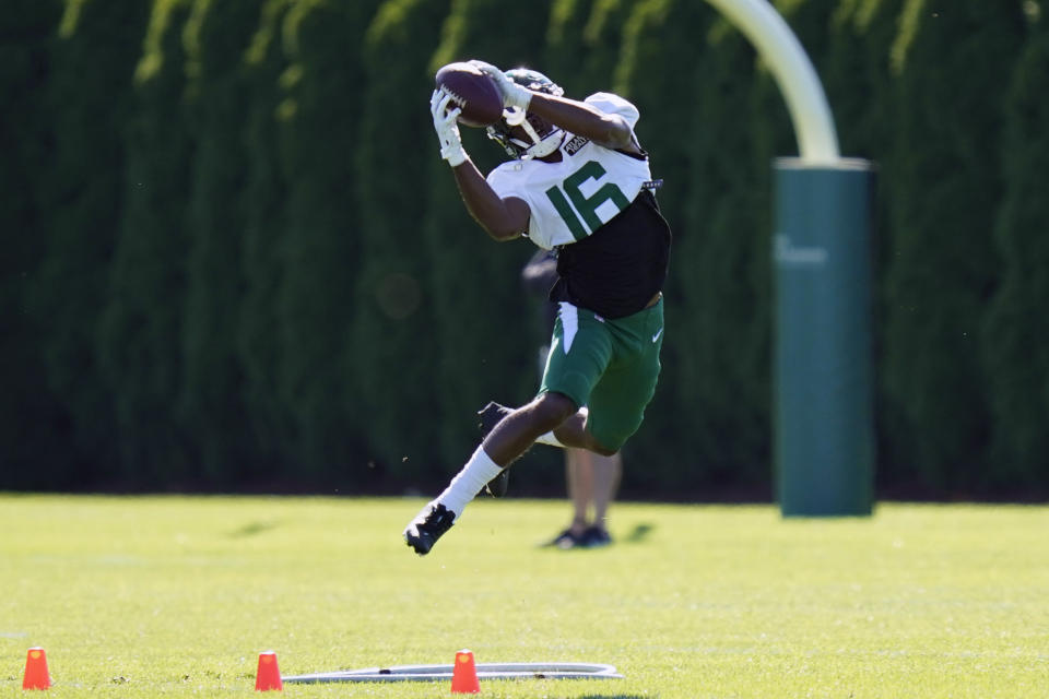 New York Jets' Jeff Smith makes a catch during practice at the NFL football team's training camp in Florham Park, N.J., Thursday, Aug. 20, 2020. Jeff Smith was a quarterback for as long as he can remember before a position switch to wide receiver in college. It turned out to be his unexpected path to the NFL. (AP Photo/Seth Wenig)