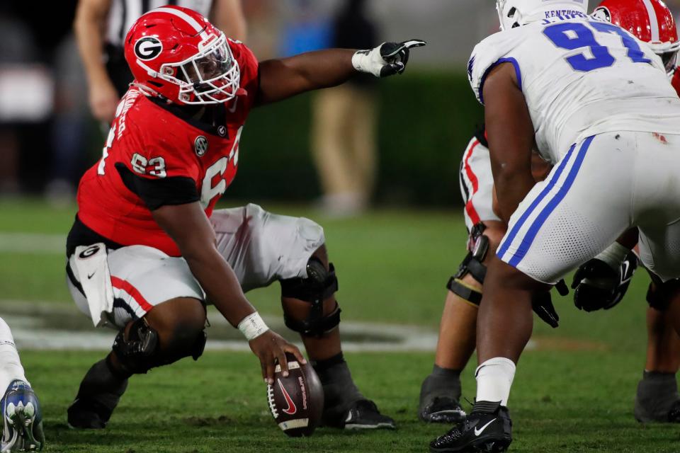 Georgia offensive lineman Sedrick Van Pran (63) gives direction during the second half of a NCAA college football game against Kentucky in Athens, Ga., on Saturday, Oct. 7, 2023.