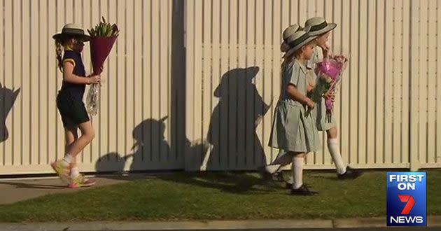 Classmates leave tributes outside the Kedron home.