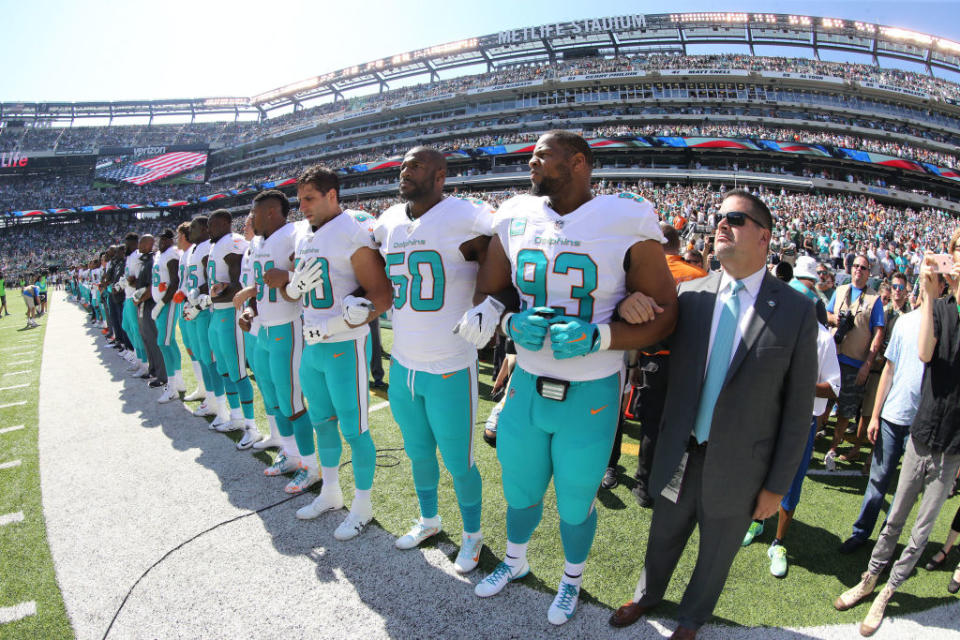 Miami players stand during the anthem. (Getty)