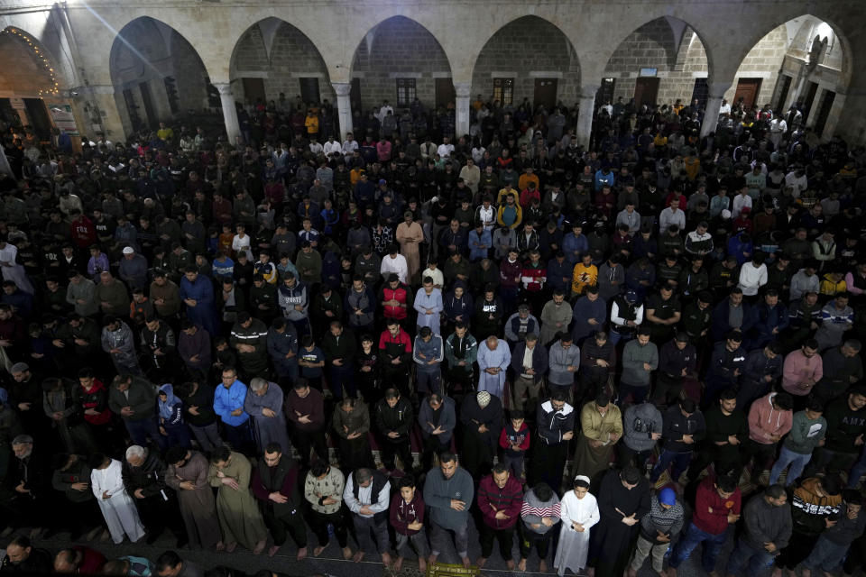 Palestinian Muslim worshippers pray during Laylat al-Qadr, also known as the Night of Destiny, at al Sayed Hashim mosque in Gaza City, early Tuesday, April 18, 2023. Laylat al-Qadr is marked on the 27th day of the holy fasting month of Ramadan and is commemorated as the night Prophet Muhammad received the first revelation of the Quran. Muslims traditionally spend the night in prayer and devotion. (AP Photo/Adel Hana)