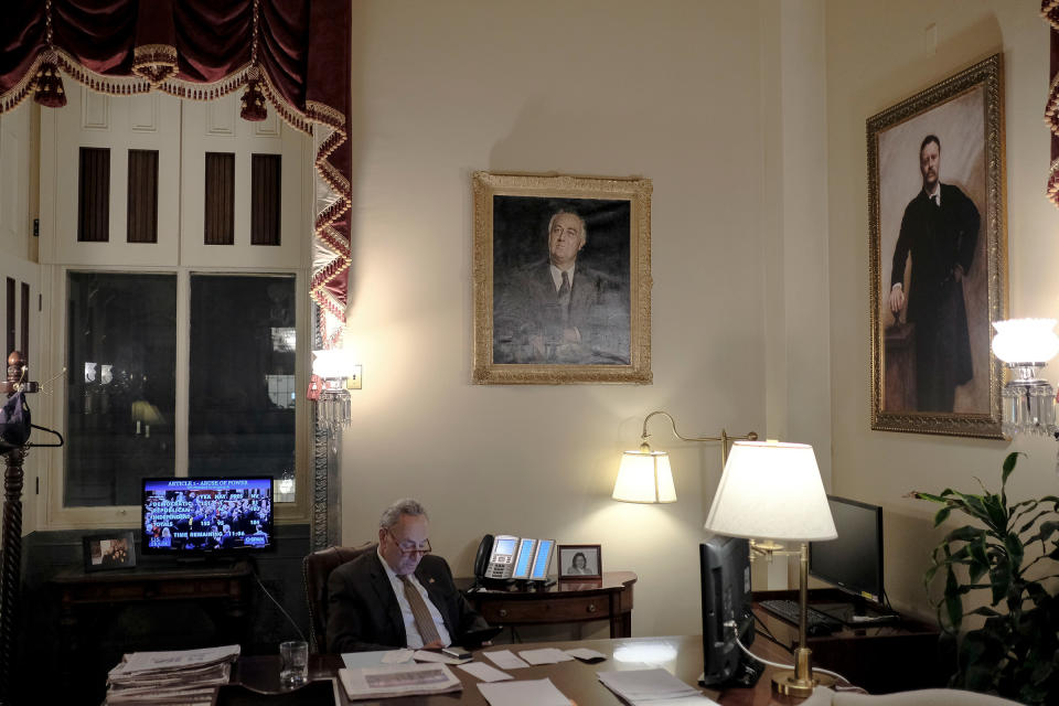 Senate Minority Leader Chuck Schumer (D-N.Y.) watches the House vote on the articles of impeachment in his office at the Capitol in Washington, D.C., on Dec. 18, 2019. | Gabriella Demczuk for TIME