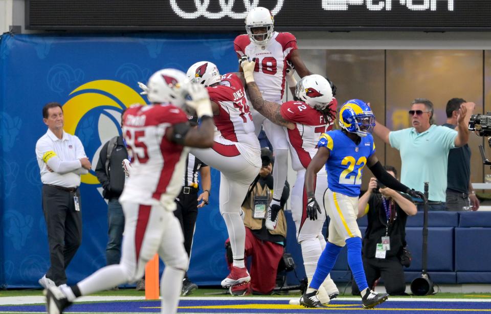 Nov 13, 2022; Inglewood, California, USA;  Arizona Cardinals wide receiver A.J. Green (18) is lifted in the air after a touchdown catch in the first half against the Los Angeles Rams at SoFi Stadium.