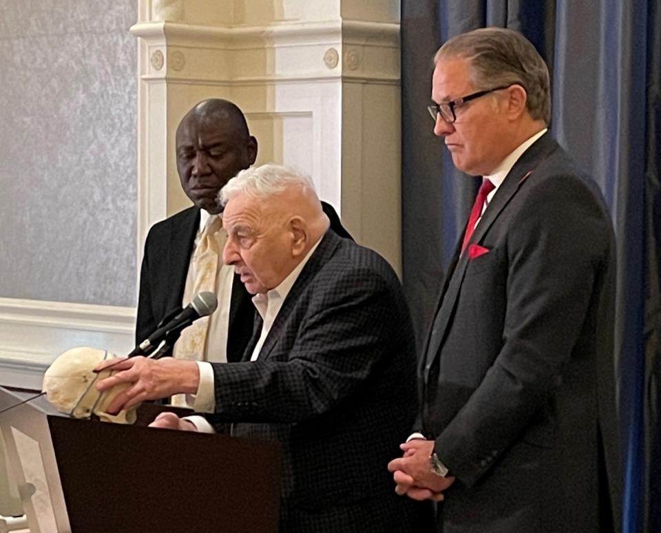 Attorney Ben Crump, left, forensic pathology expert Dr. Werner Spitz and attorney Ven Johnson speak during a news conference in Detroit on Tuesday, April 19, 2022. The three talked about the independent autopsy performed on Patrick Lyoya by Spitz.